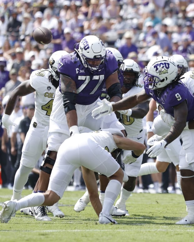 CU Horned Frogs running back Emani Bailey (9) fumbles the ball in the first quarter against the Colorado Buffaloes at Amon G. Carter Stadium. 